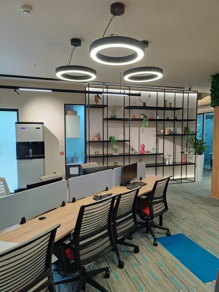 Meeting room with a long table and office chairs