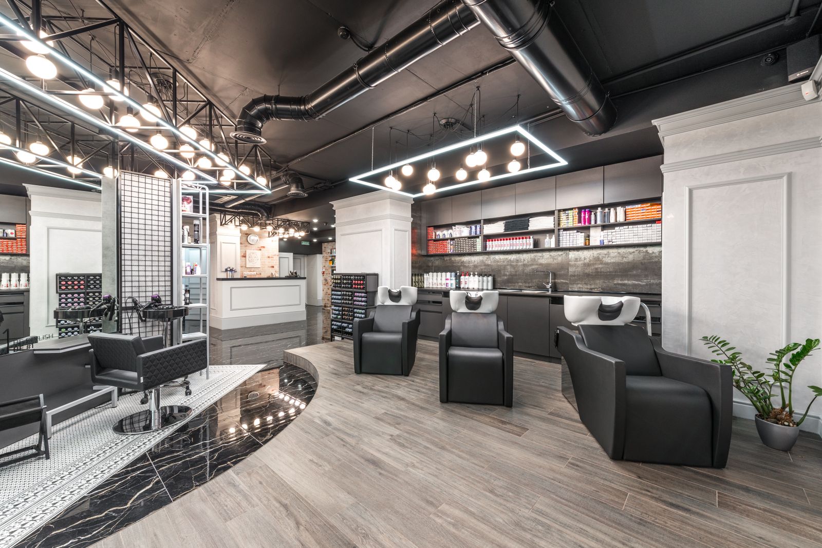 Beauty salon interior with backwash chairs and sinks